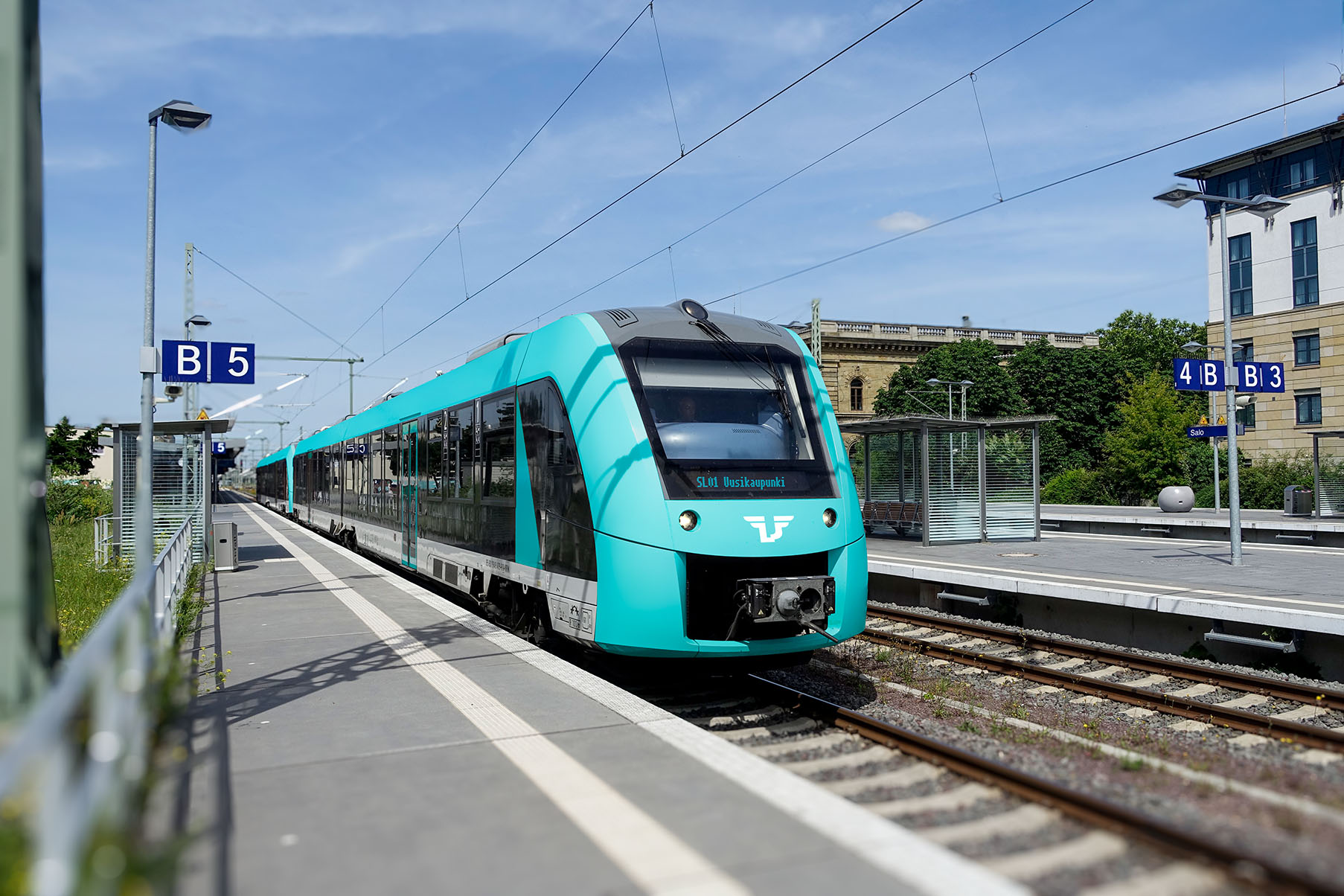Luonnos Suomen Lähijunien junasta asemalla